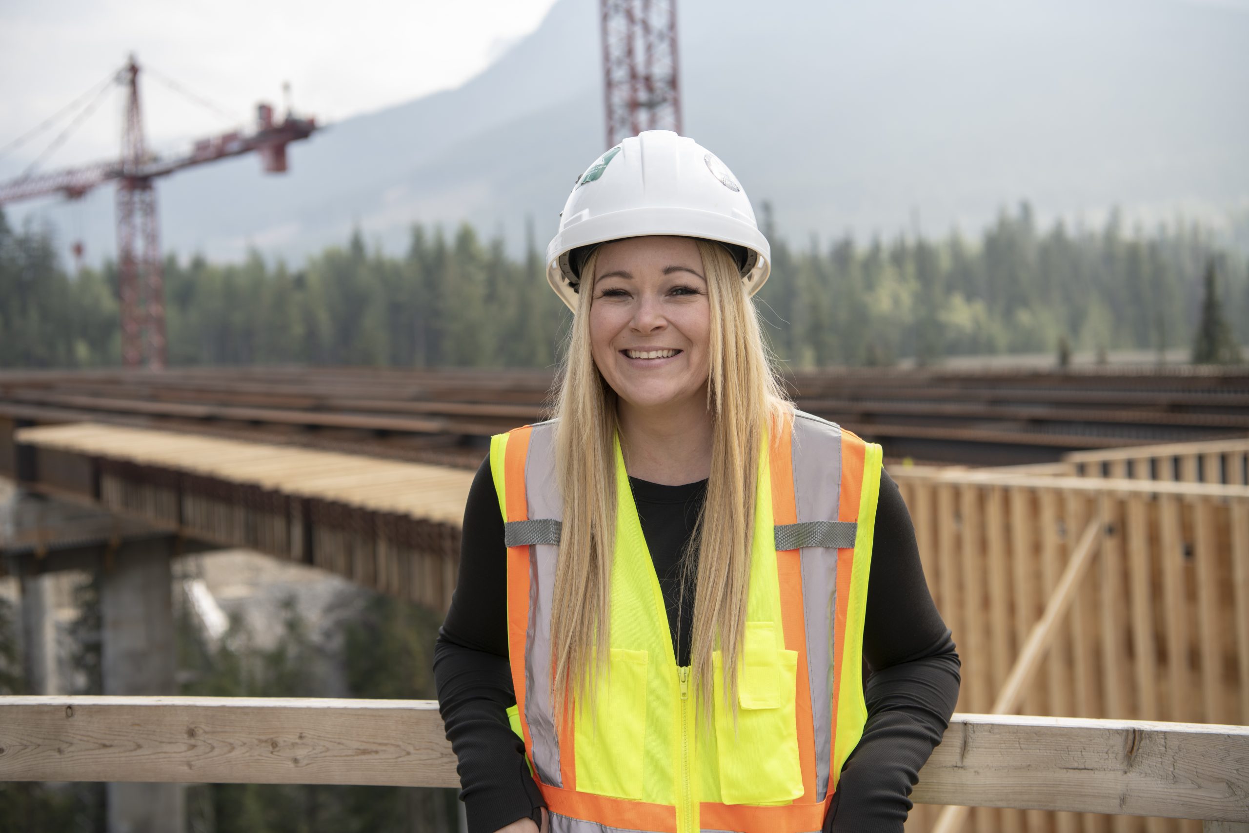 An image of a British Columbia Infrastructure Benefits worker named Angela smiling