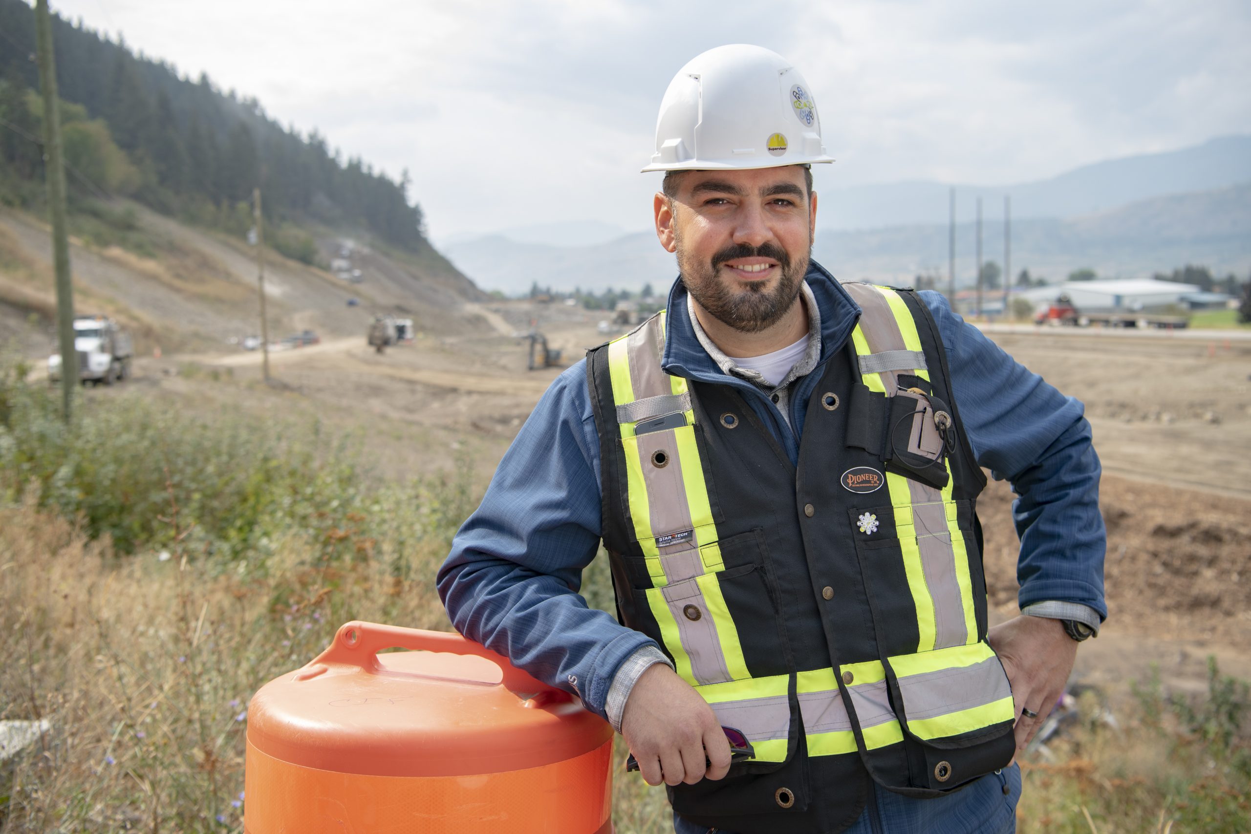 An image of a worker smiling