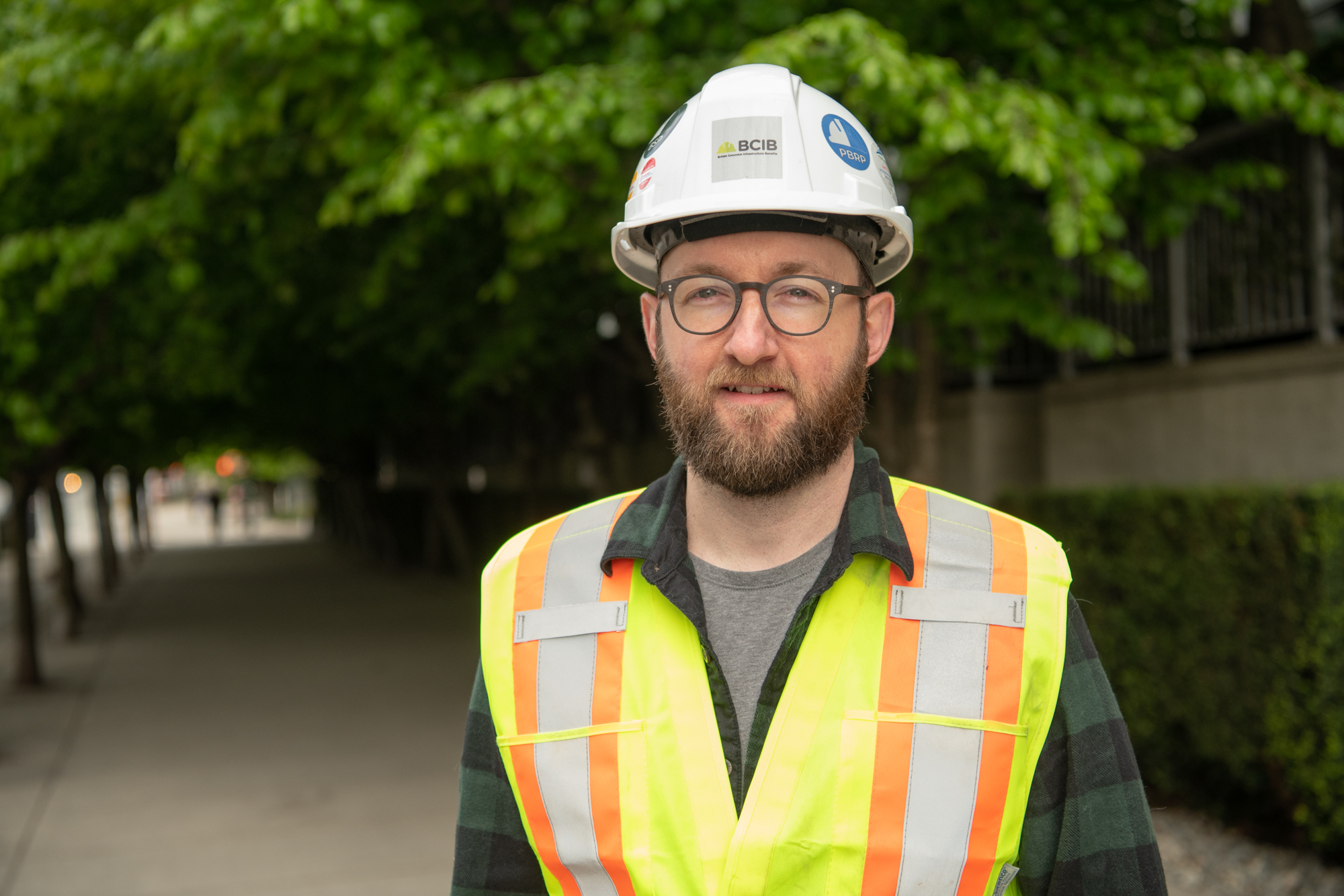 An image of a worker named Chris smiling