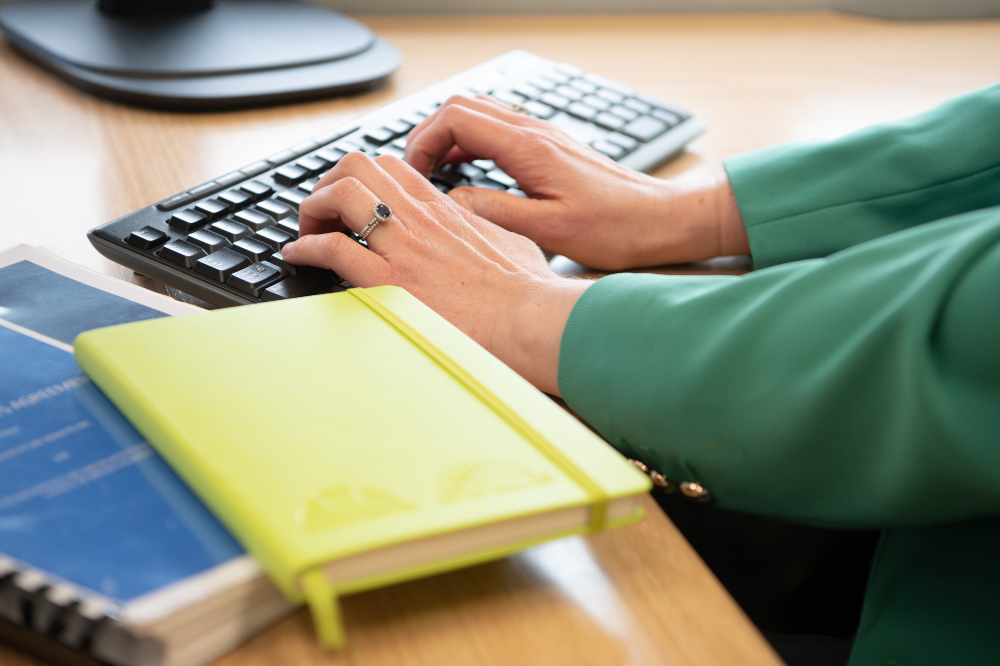 Reports and Resources Hero hand typing Image