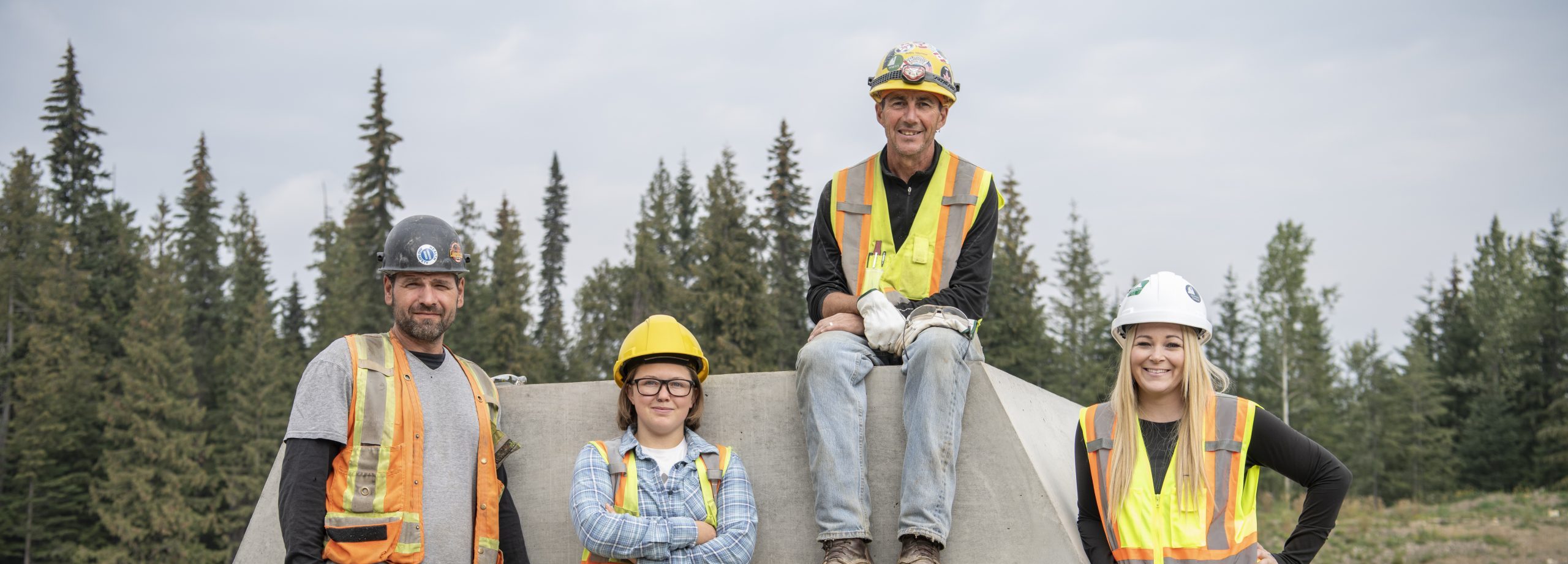 A group photo of BCIB employees named Milan, Zoe, Angela smiling